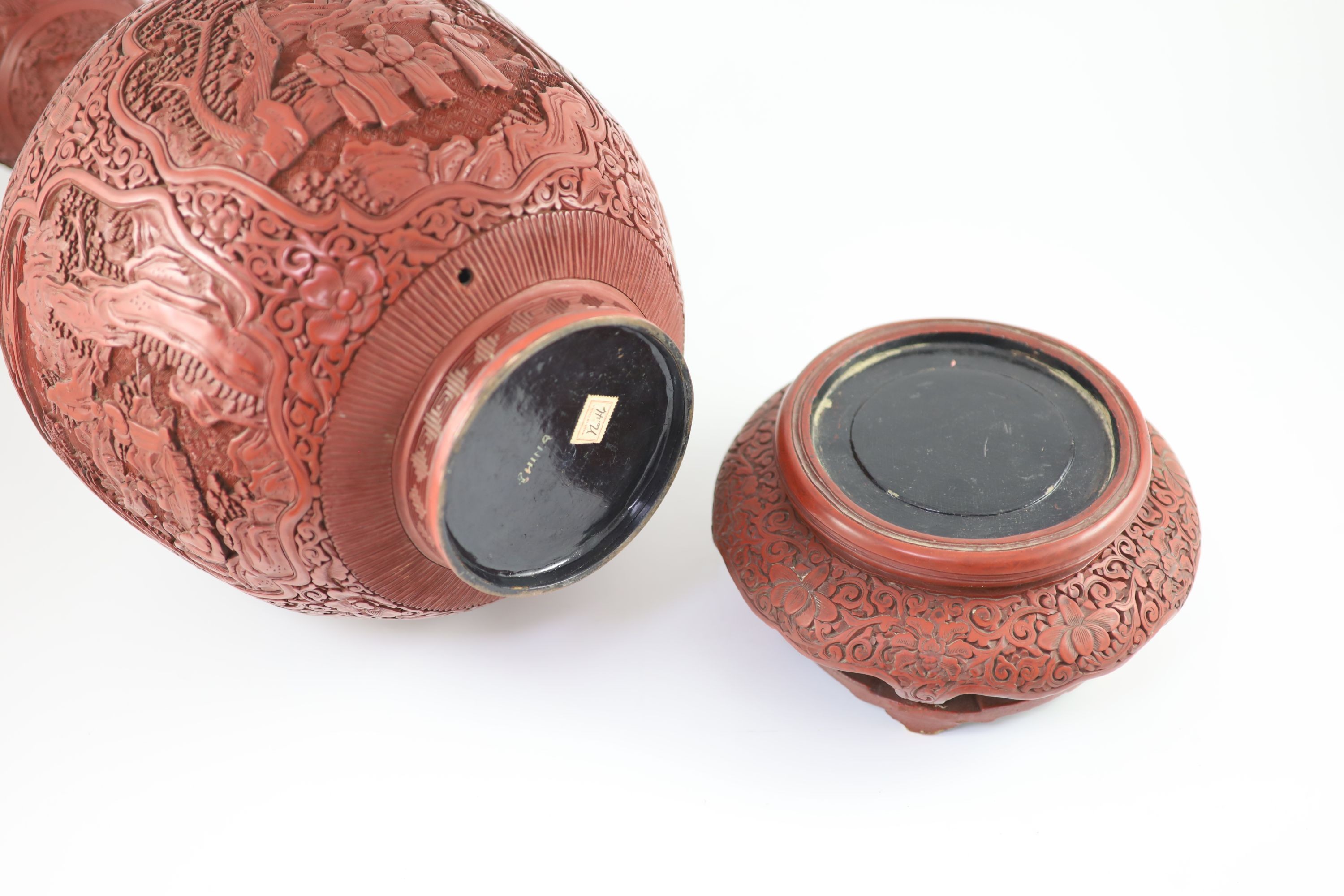 A large Chinese cinnabar lacquer garlic-neck vase and stand, c.1900, Total height 60.5 cm, base of vase drilled